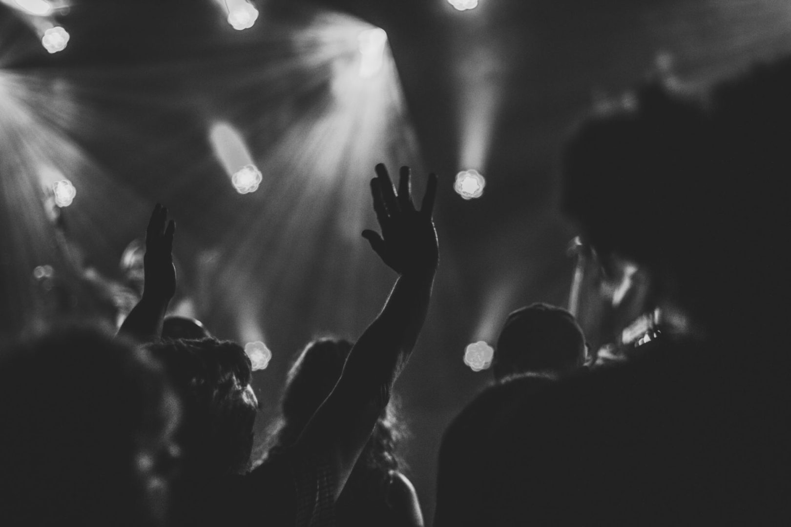 An audience of various people enjoying a worship experience.