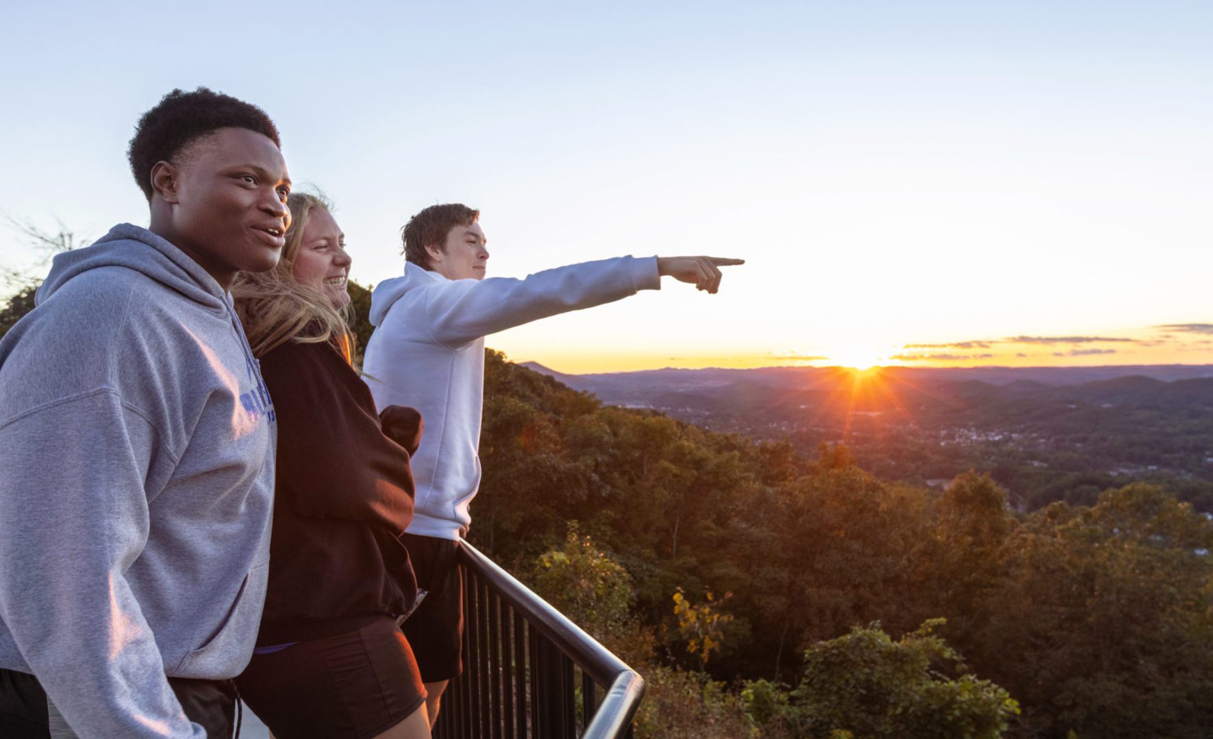 Three Bluefield University students from the Appalachian Outdoor Club visiting the East River Mountain Scenic Overlook.