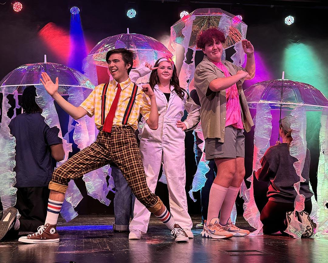 Three cast members dressed as SpongeBob, Patrick, and Sandy.