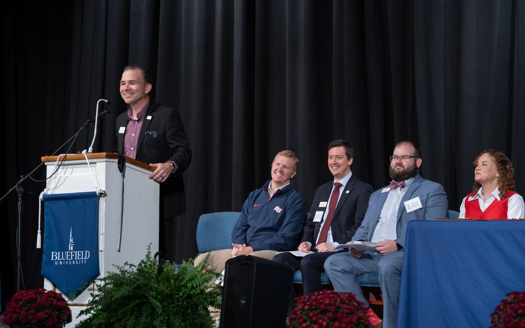 University personnel present alumni awards