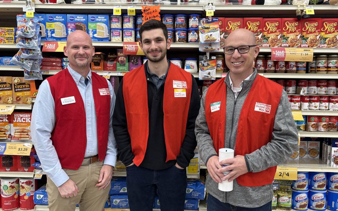 Dr. Michael Salmeier, Harrison Rice and Travis Roberts wearing United Way vests