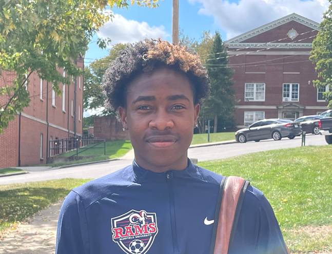 Denzel Dzokamushure receives a Ram of the Week certificate