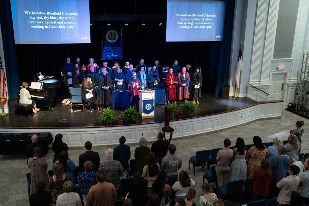 Dr. Yowell leads the congregation in the Alma Mater.