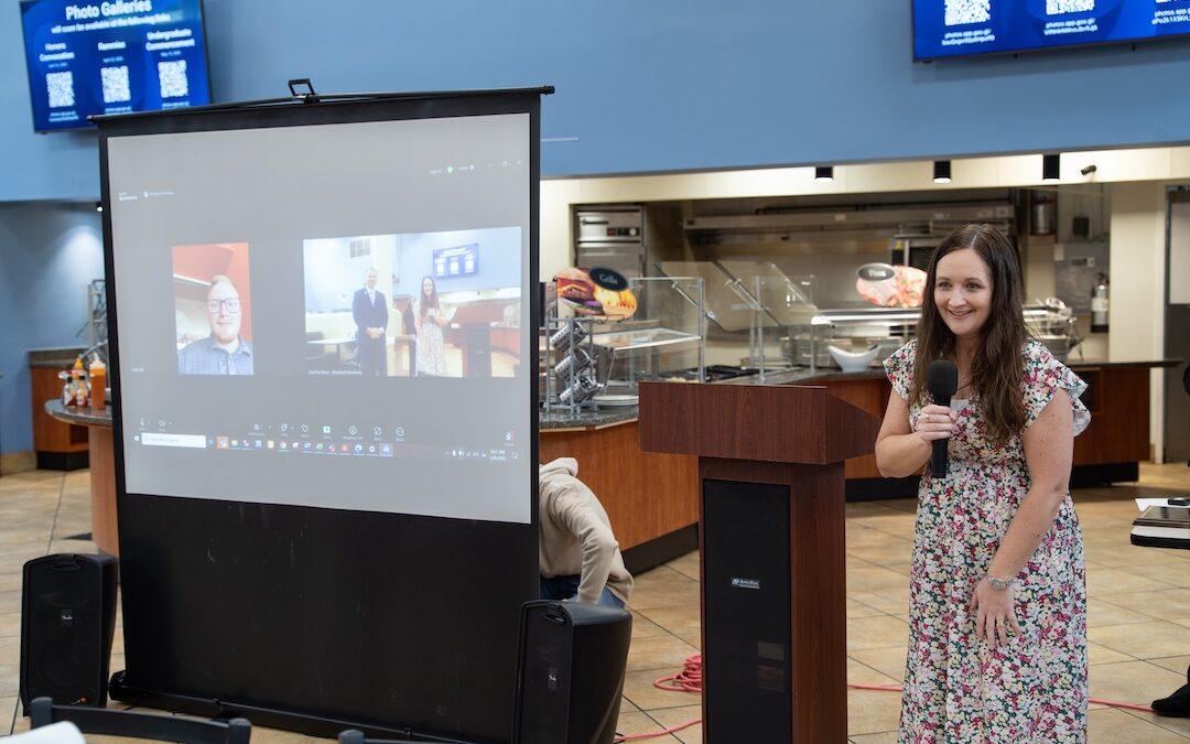 Jacob Key is presented with the Distinguished Staff Award through a video call.