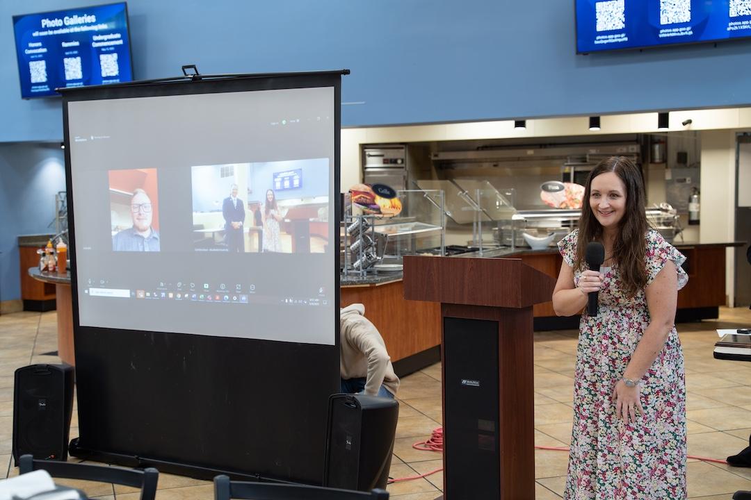 Jacob Key is presented with the Distinguished Staff Award through a video call.