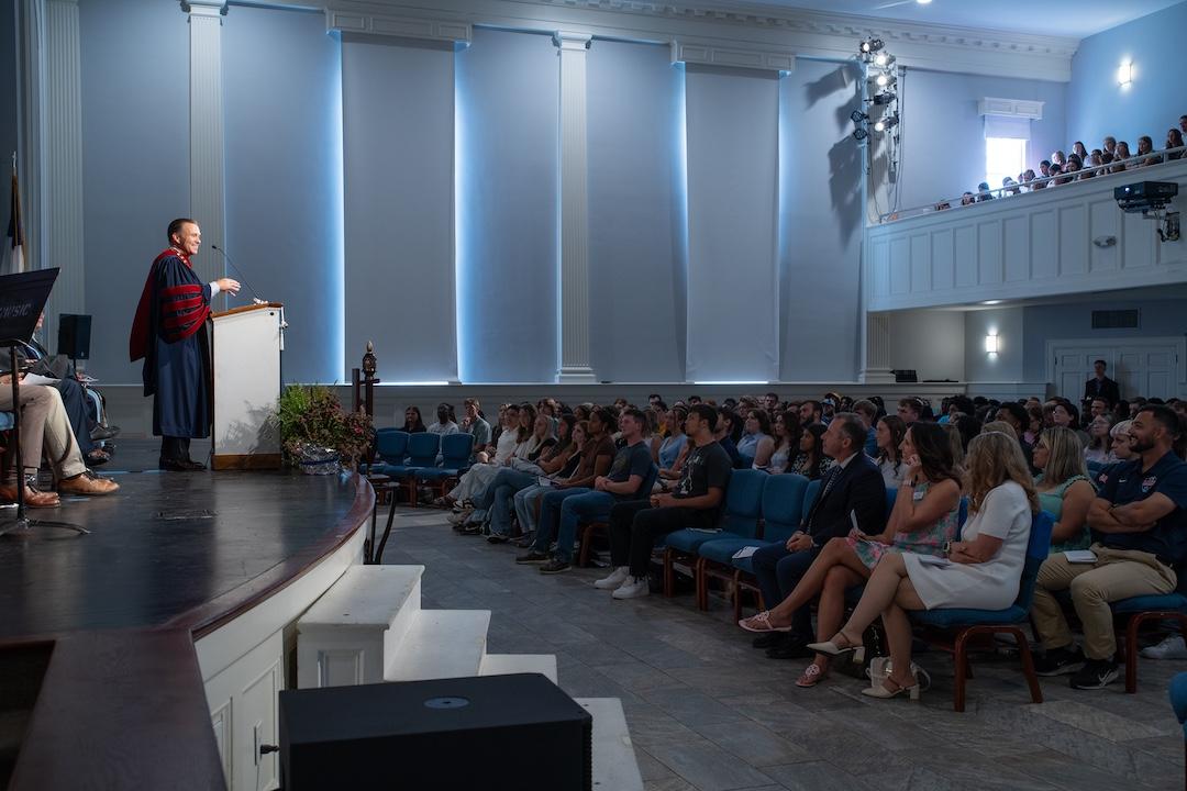 President Dr. Steve Peterson speaks to the campus community in the chapel.