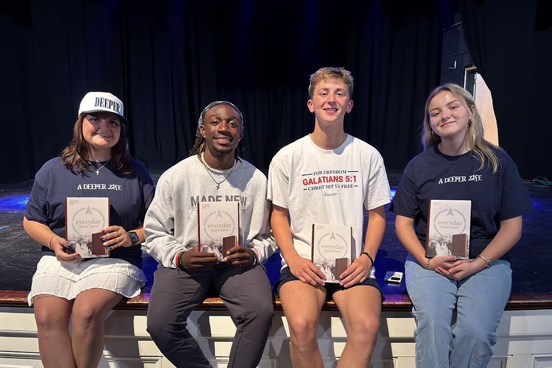 Students holding Bibles.