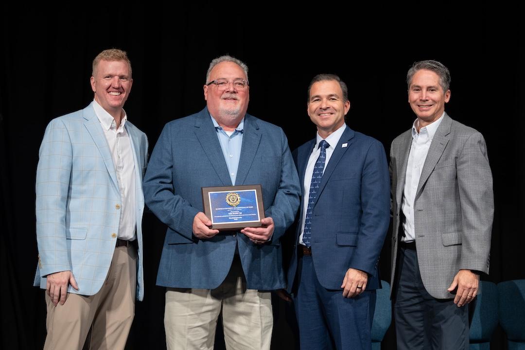 Tim Mann receives an award.