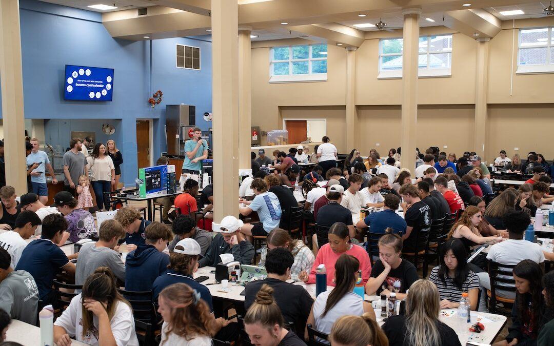 Students play bingo in the cafeteria.