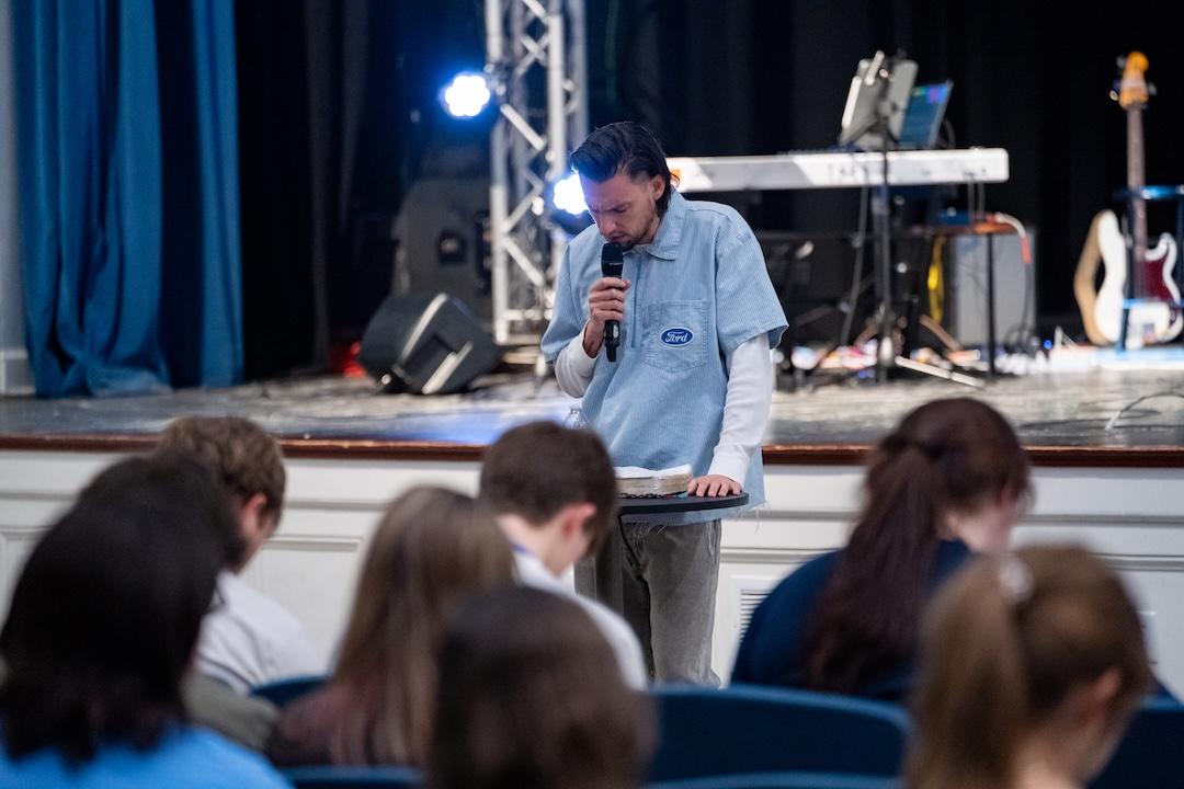 Aaron Smith leads prayer at a previous Revival Night.