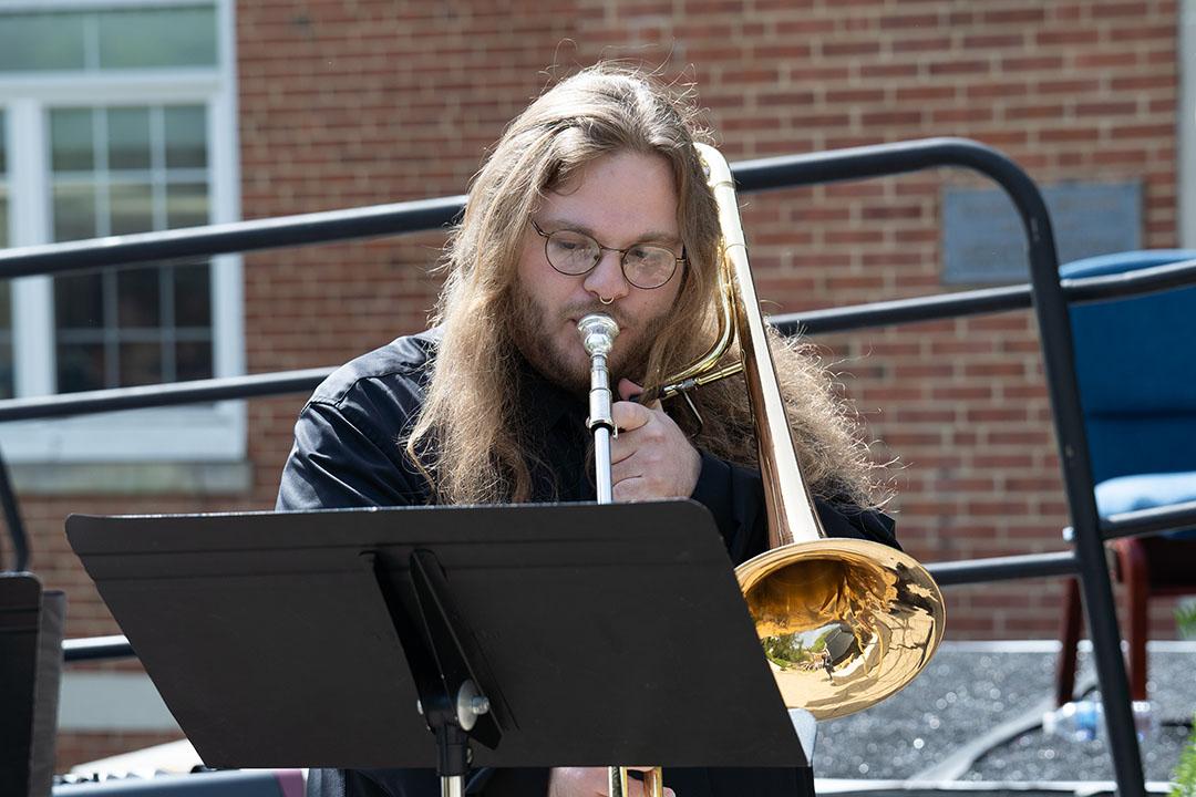 A man playing an instrument.