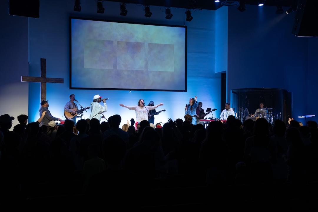 Students leading worship at a conference.