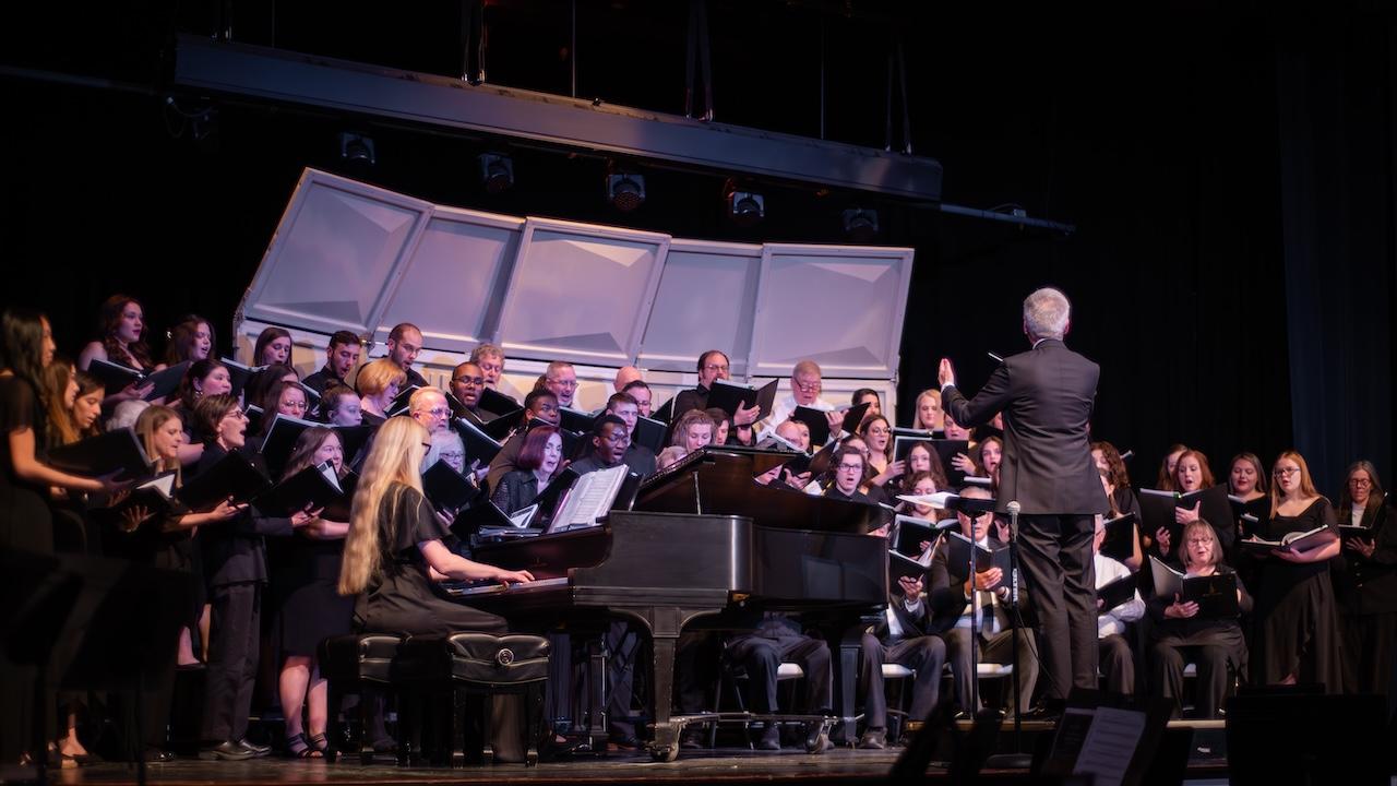 A choir of students and alumni.