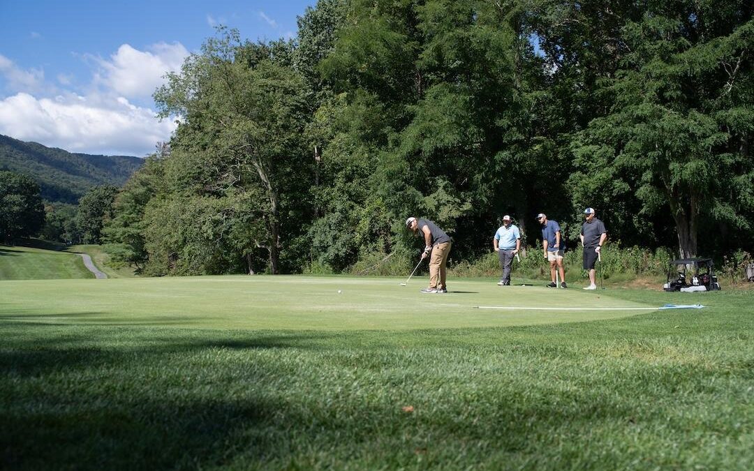 An image of four golfers.