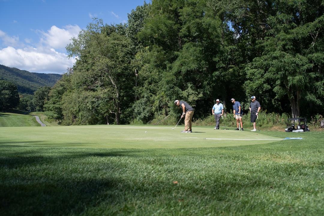 An image of four golfers.