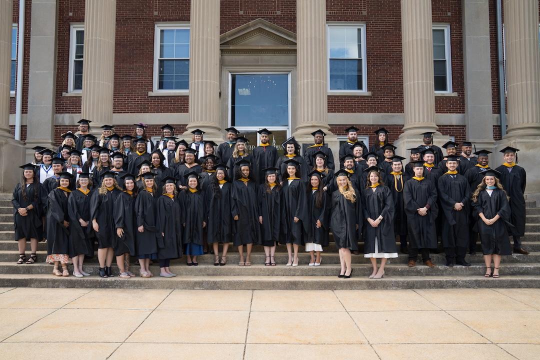 Grad-Class-of-2026 A group of people in graduation caps and gowns.