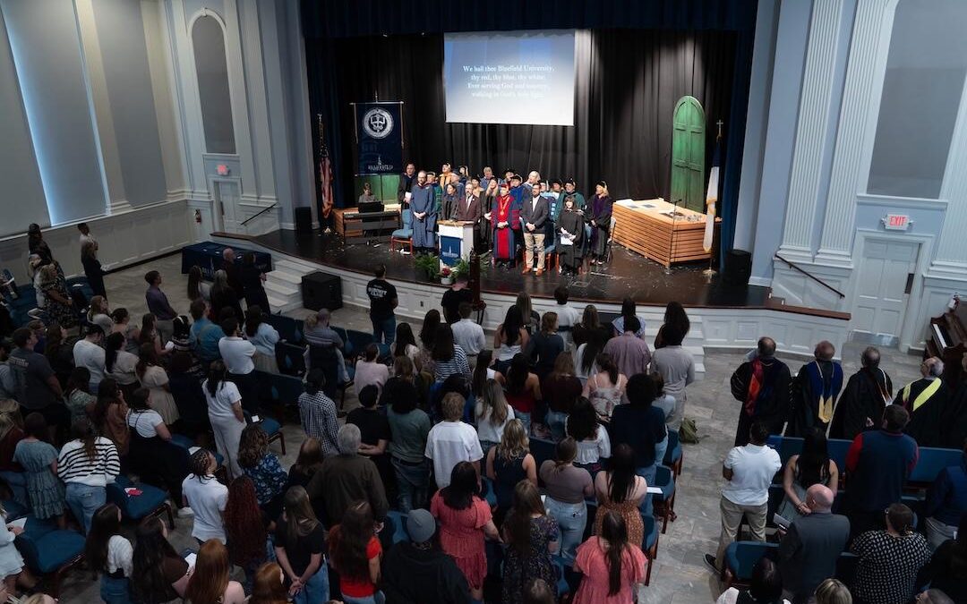 Dr. Yowell leads the congregation in a song in the chapel.