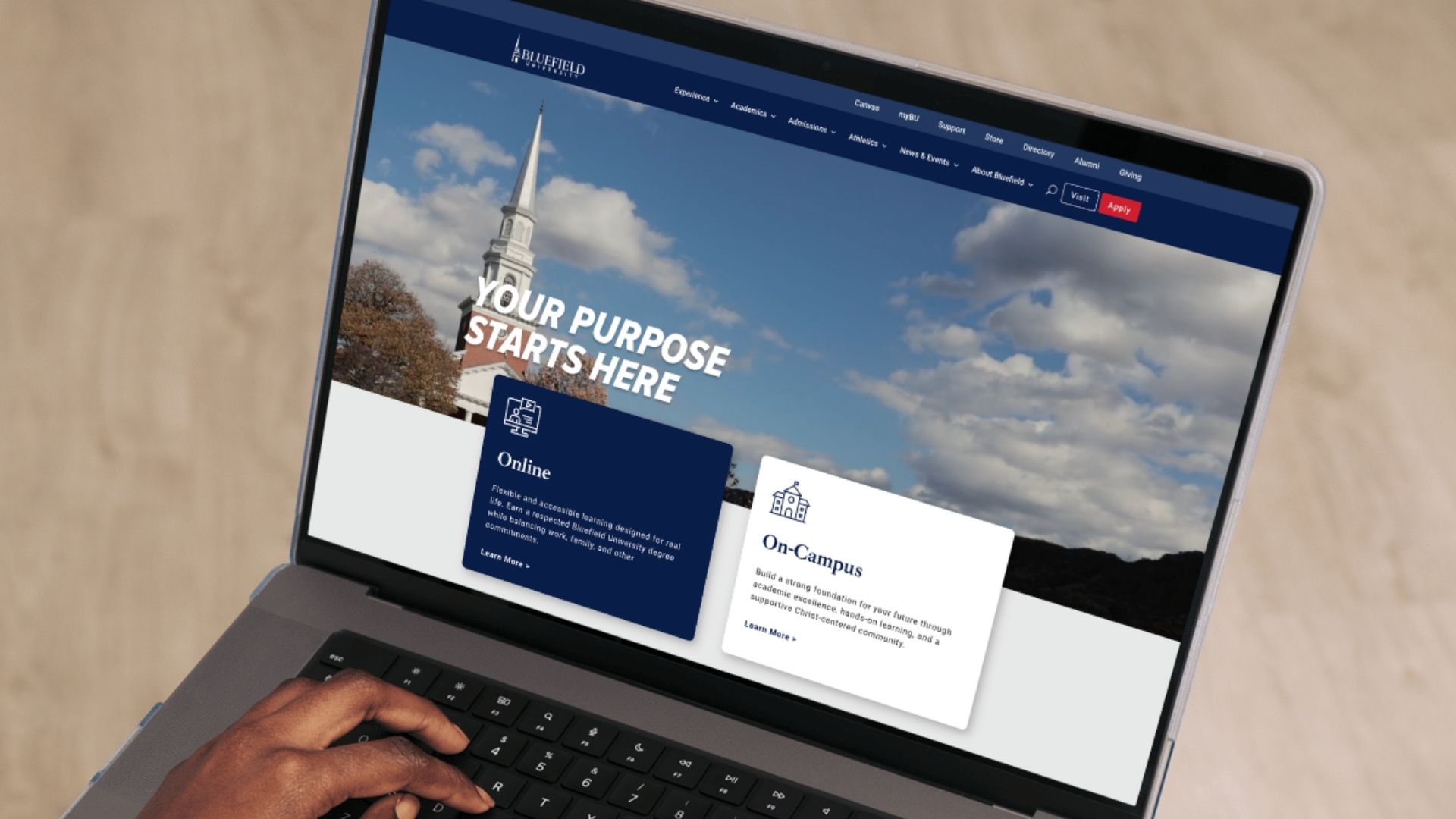 A picture of a laptop with the Bluefield University website on its screen.
